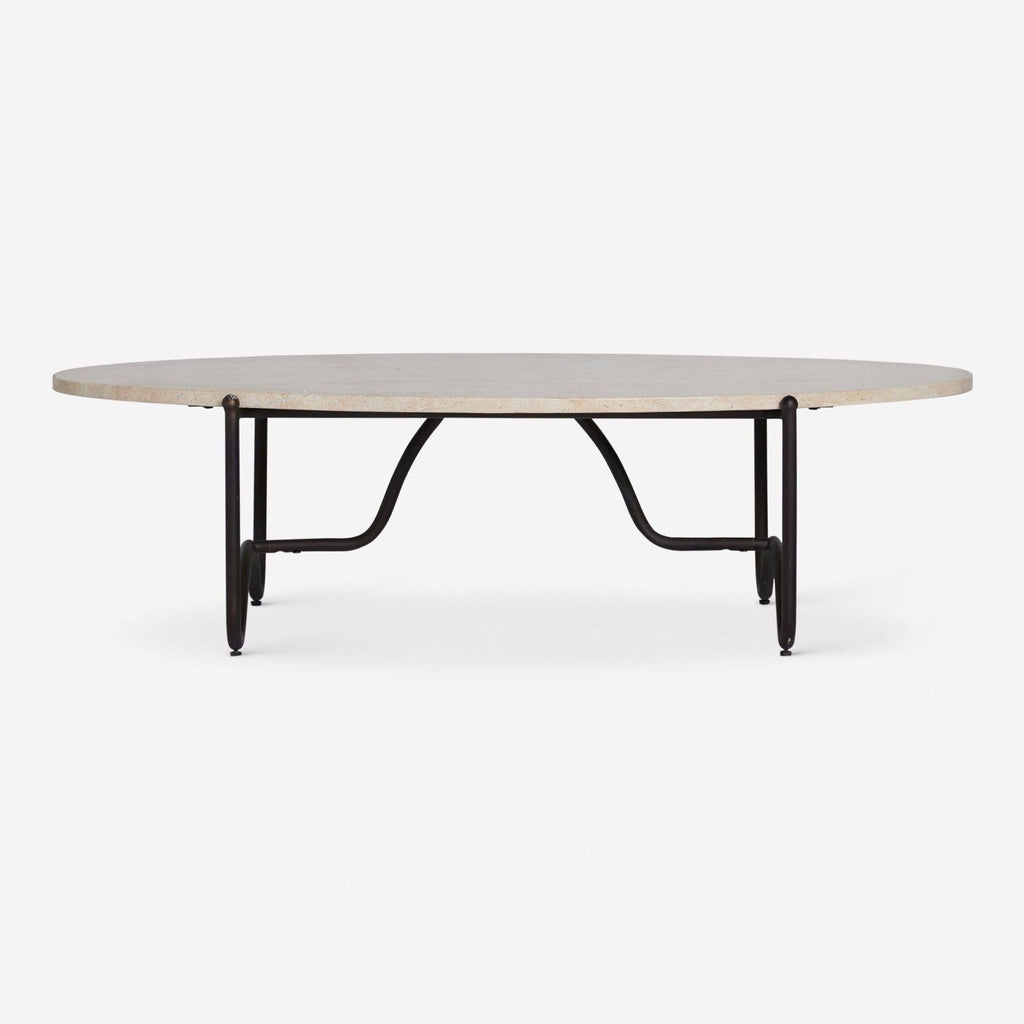 Round Lulu and Georgia coffee table with a travertine top and black metal curved base.  