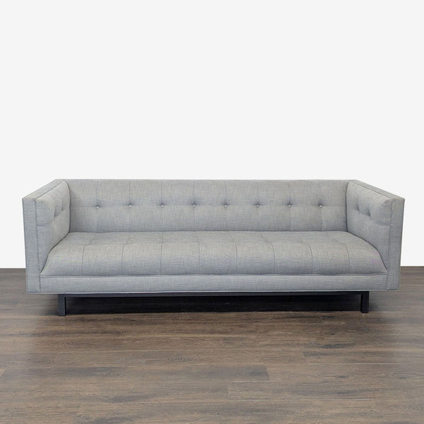 Restoration Hardware 3-seat sofa with light gray fabric, button-tufted back and seat, and modern clean lines.