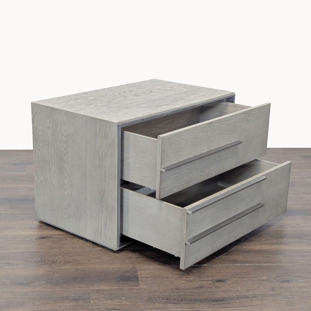 Modern end table featuring sandblasted white oak, stainless steel hardware, and striking asymmetrical lines.