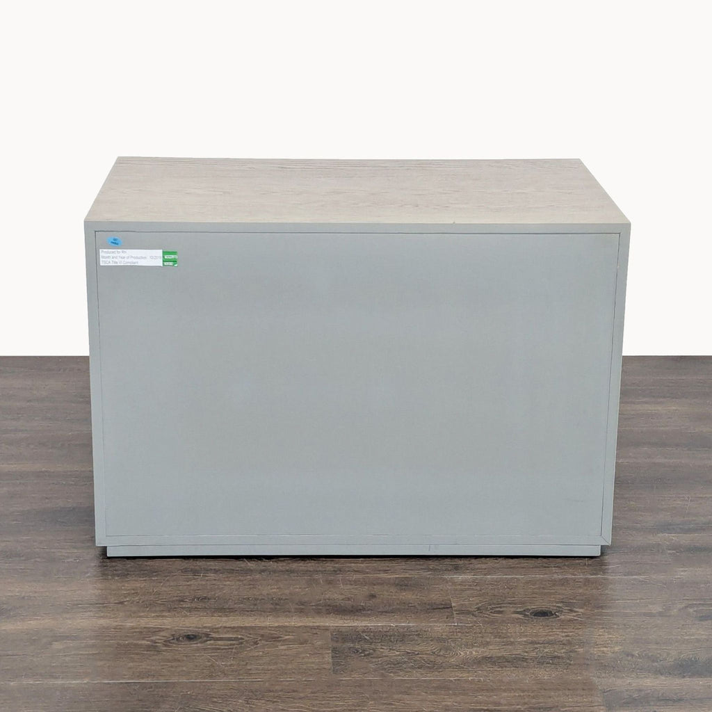 Contemporary end table with framed white oak, raised metal accents, and a hand-finished patina, Restoration Hardware.