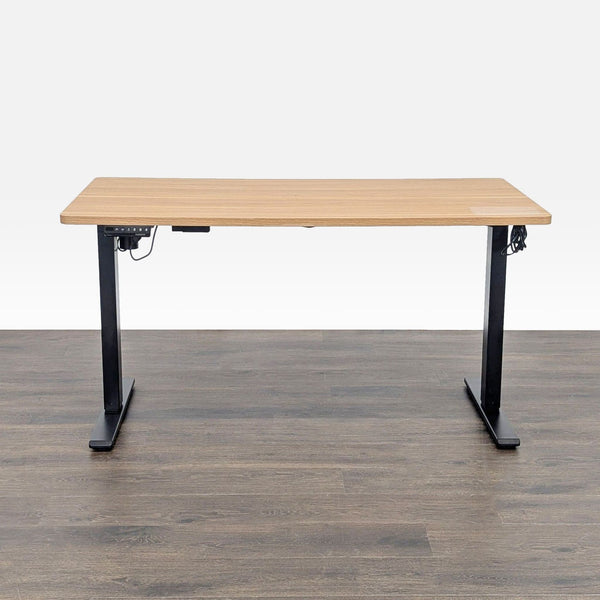 Electric standing desk by Flexispot with black metal frame and wood top, suitable for home or office use.