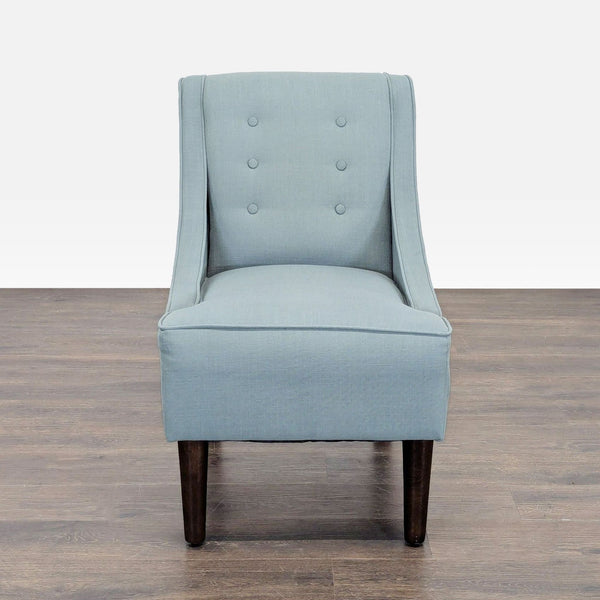Skyline Imports lounge chair with soft blue fabric, button-tufted back, and dark wood legs.