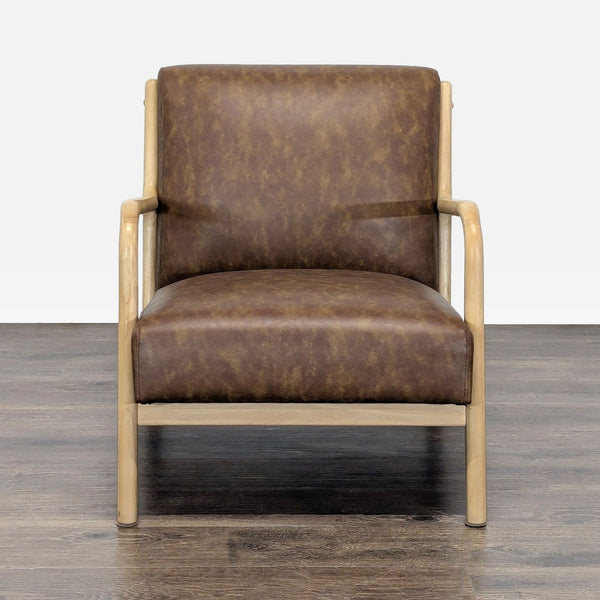 Brown faux leather Target lounge chair with padded cushion and light wood frame, featuring curved arms for comfort.