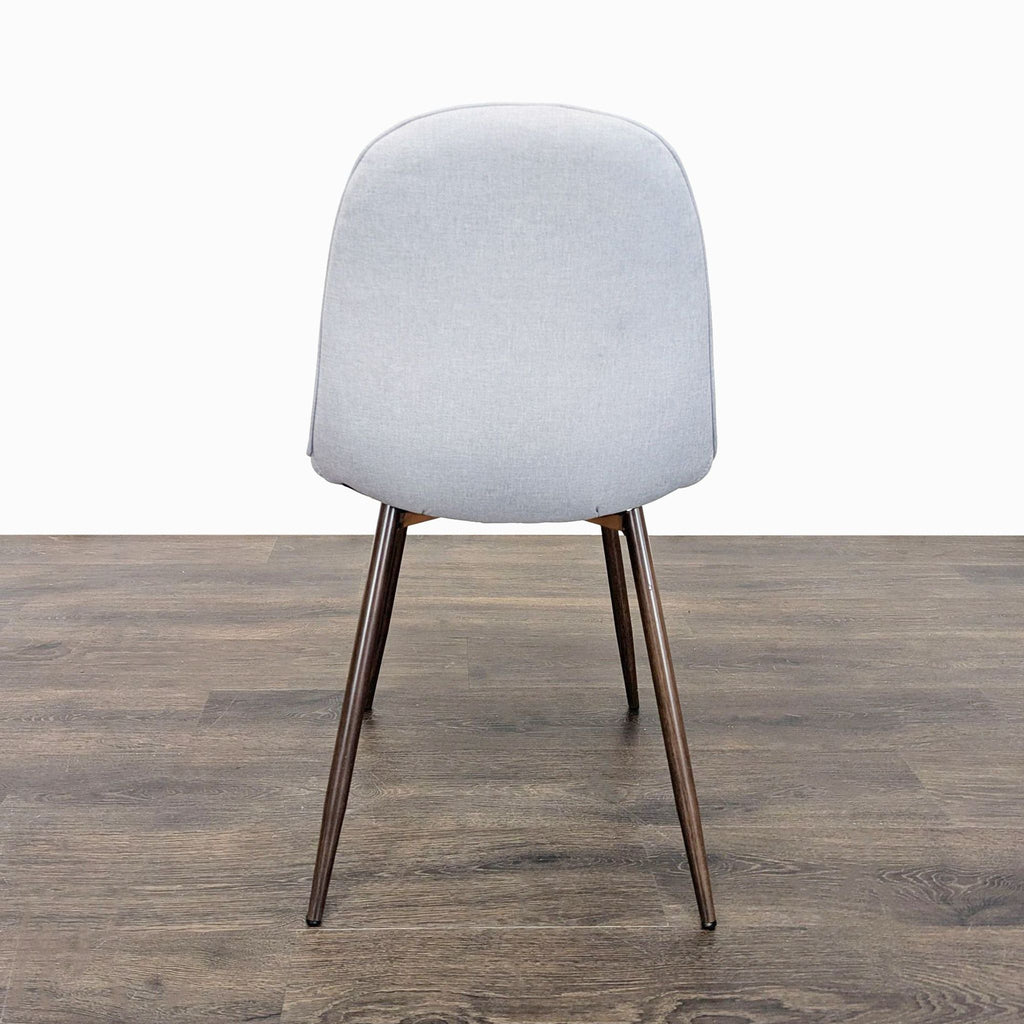 Dorel Home dining chair featuring a cushioned seat and sleek metal legs.