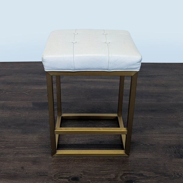 1. Restoration Hardware leather bench with button-tufted upholstery and sleek metal base.  