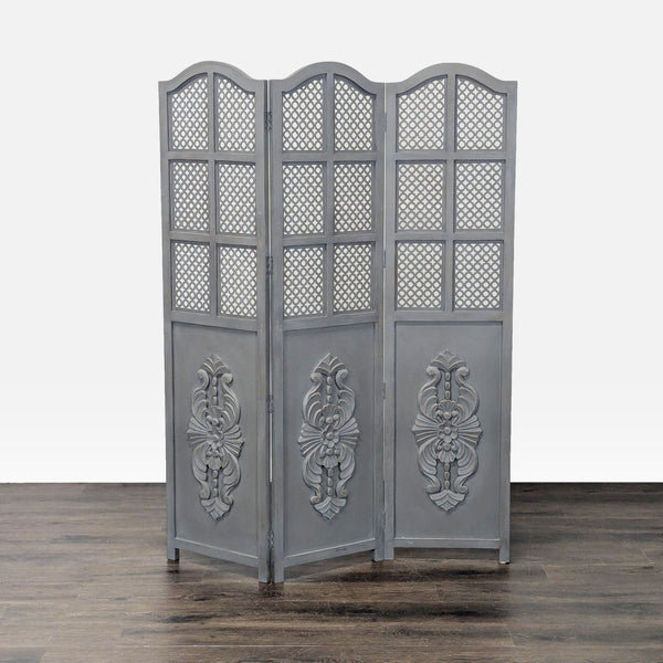 1. Gray folding room divider by World Market with ornate carved panels and lattice pattern on upper sections.