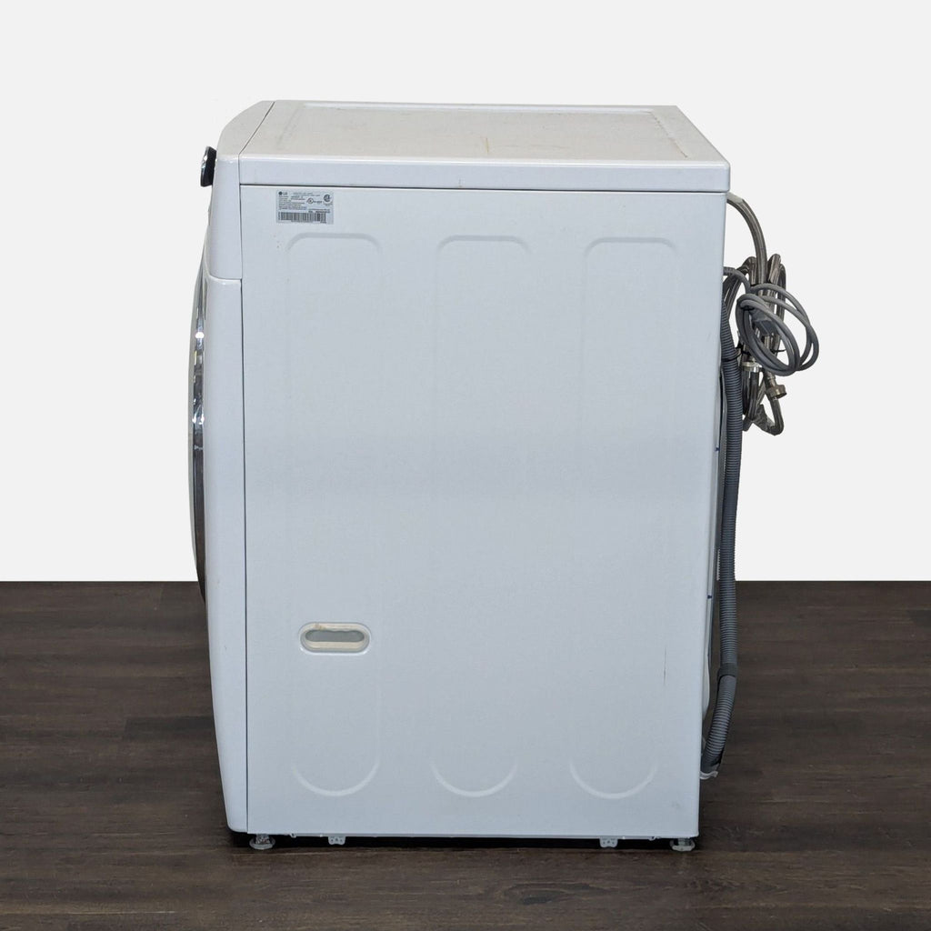 2. LG brand washer/dryer showing a modern control panel and round front-loading door, appliance for laundry.  