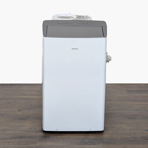Danby portable air conditioner with sleek design and top control panel, ideal for efficient room cooling.