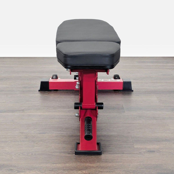 REP Fitness adjustable weight bench with red steel frame, padded seat, and easy incline or flat adjustments.