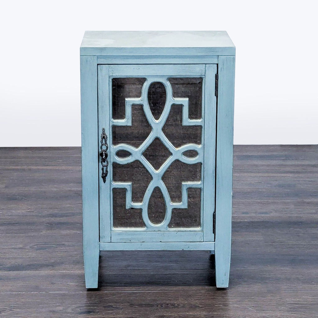 Leighton accent cabinet with hand-painted turquoise finish, mirrored door, and decorative scrollwork overlay.