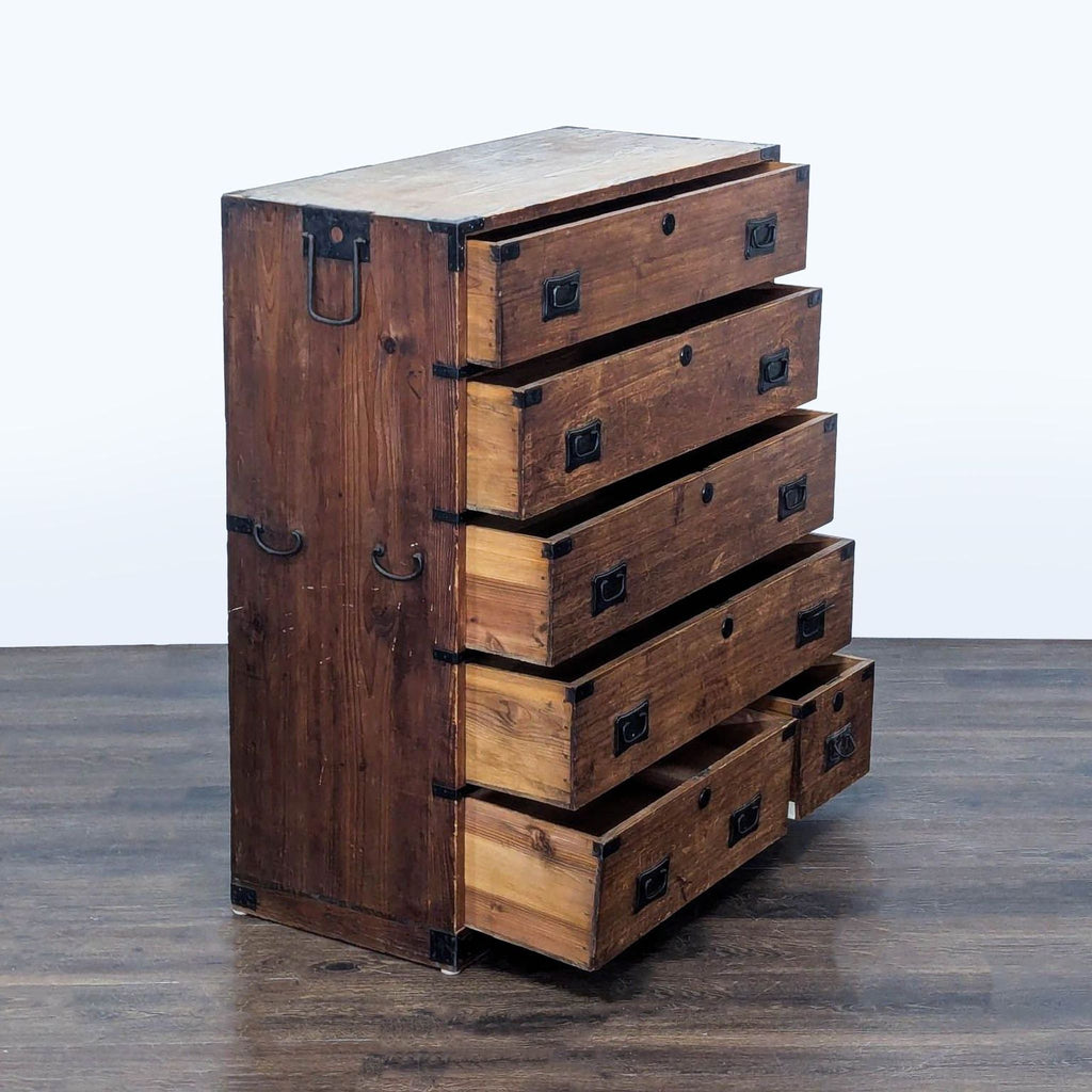 Rustic dresser featuring spacious drawers, sturdy metal hardware, and a timeless wood finish.  