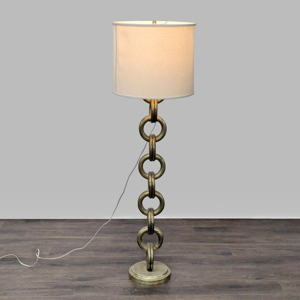 Pottery Barn floor lamp with chain link metallic base and white drum shade, ideal for living rooms or offices.