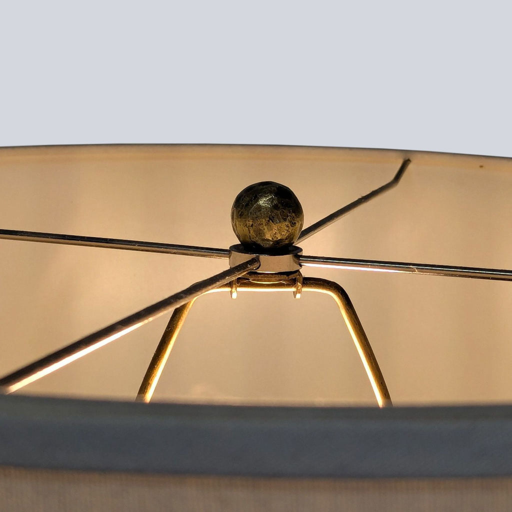 Statement lighting piece from Pottery Barn with sturdy chain link base and drum shade, blending function and decor.