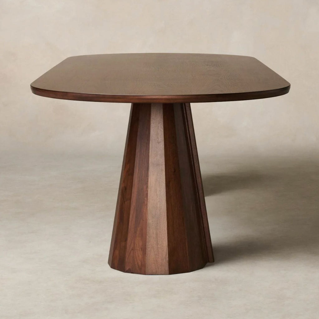 2. Modern round Bank Table by Maiden Home featuring a unique overlapping base and smooth, beveled edges.  