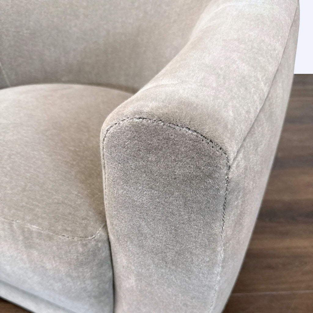Rounded Maiden Home lounge chair in limestone textile, offering a wide, cozy seat ideal for stylish lounging.