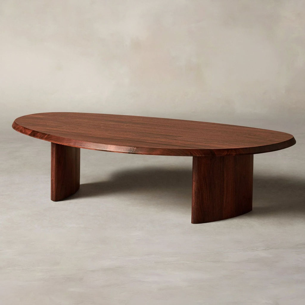 2. Side angle of a Maiden Home oval coffee table showcasing its smooth wood surface and modern design.