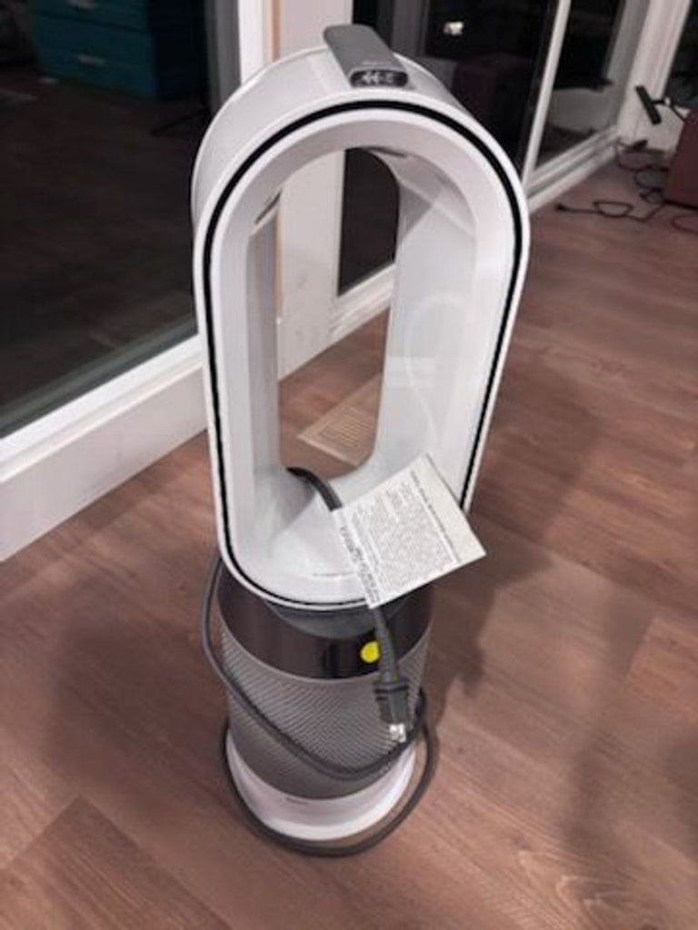1. Dyson Cooler/Heater AC & fan unit with sleek, bladeless design placed in a modern living room setting.  