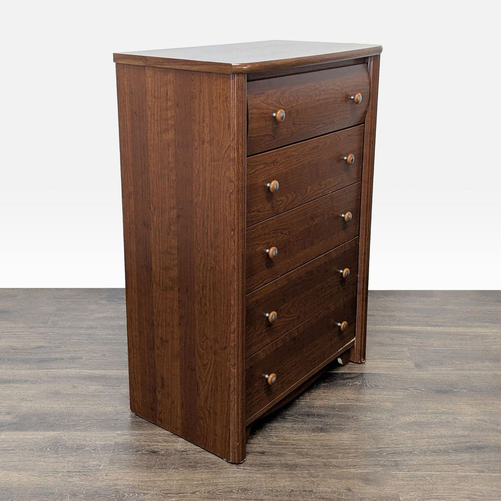 Classic brown wood dresser from Palliser Furniture, five drawers, round knobs, fits any bedroom style.