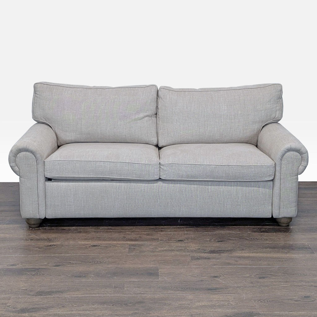 Restoration Hardware sleeper sofa in light gray fabric with rolled arms and pull-out Queen bed.