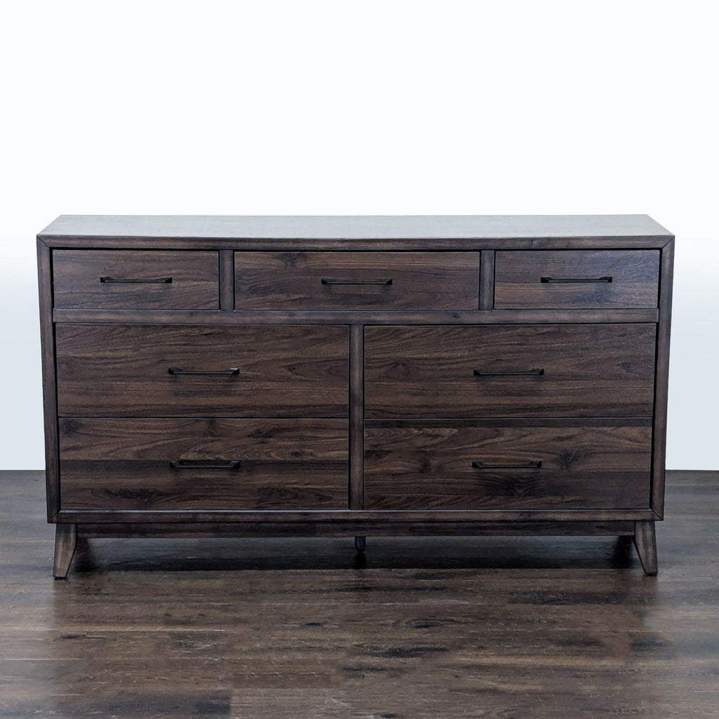 1. Front view of a Home Meridian dresser with dark wood finish and seven drawers on wood flooring.  
