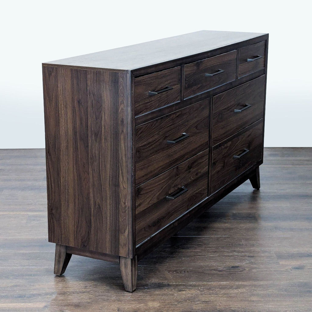 2. Angled side view of a Home Meridian dark wood dresser showing its sleek lines and modern handles.  