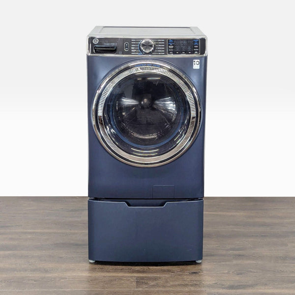 GE front load washer/dryer combo in blue with pedestal drawer, digital controls, and large door.  