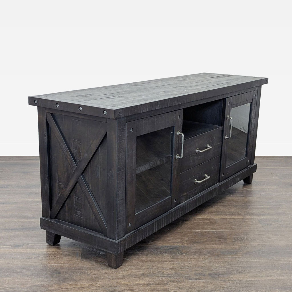 2. Angled view of a rustic black Living Spaces entertainment center with glass doors and metal handles.