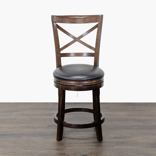 Ashley Furniture X-back wood stool with faux leather seat and footrest, shown from side angle.