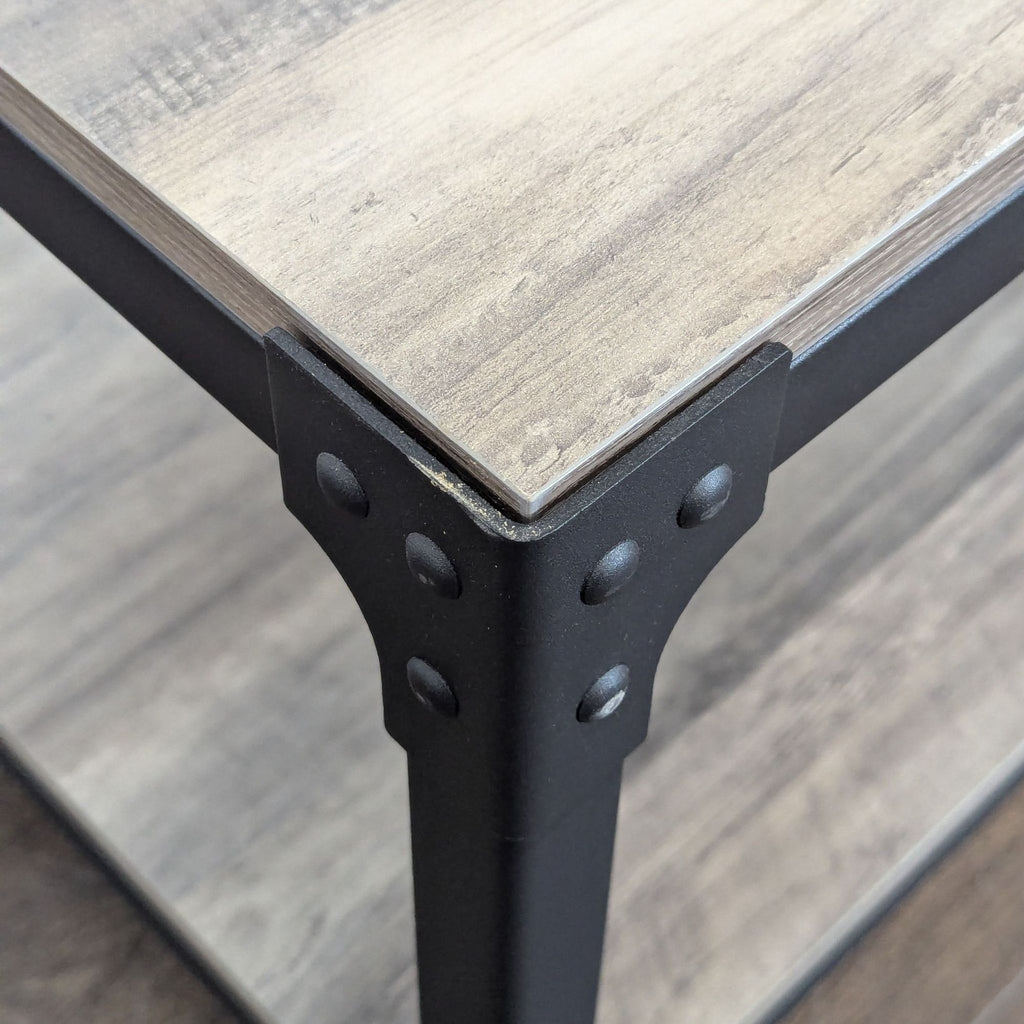 Minimalist industrial table by Walker Edison, blending sturdy steel construction with a sleek laminated wood surface.