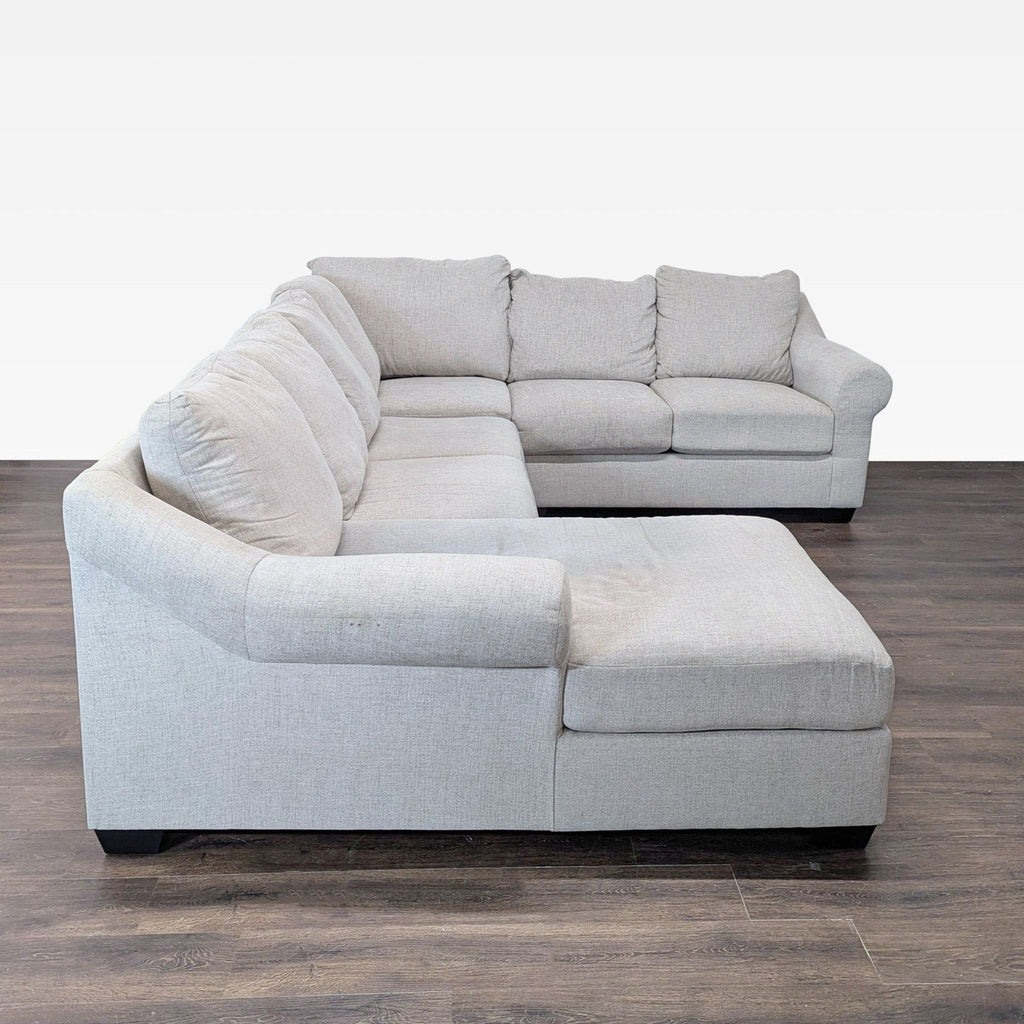 3. Contemporary sectional from Ashley Furniture, designed with comfort seating and chic style for any space.