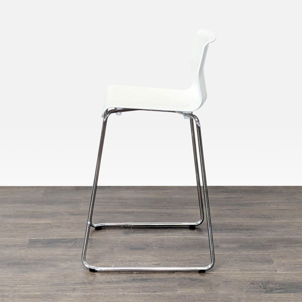 Simple plastic-seated bench from Ikea on a sturdy metal base, great for versatile seating.