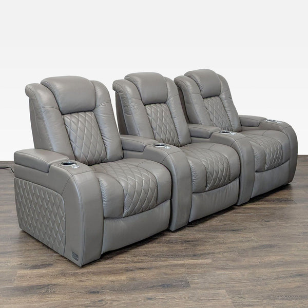 Three-seat gray leather Seatcraft Muse home theater seating with power headrest, lumbar, and recline controls.