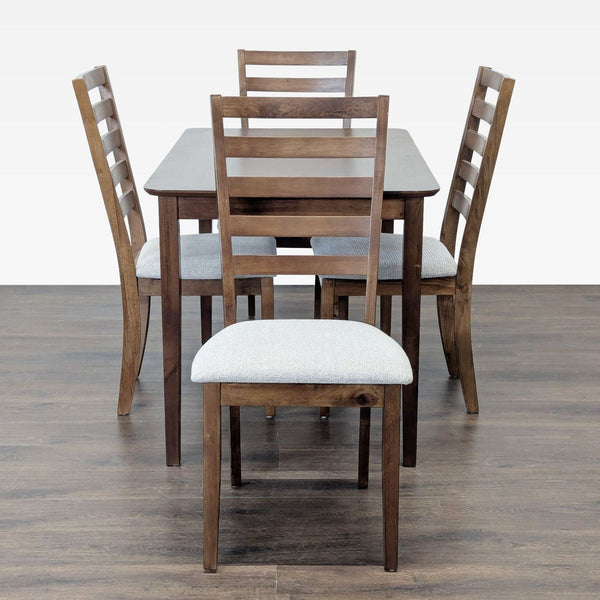 1. Four-piece brown wood dining set by Living Spaces with ladder-back chairs and upholstered seats for comfort.
