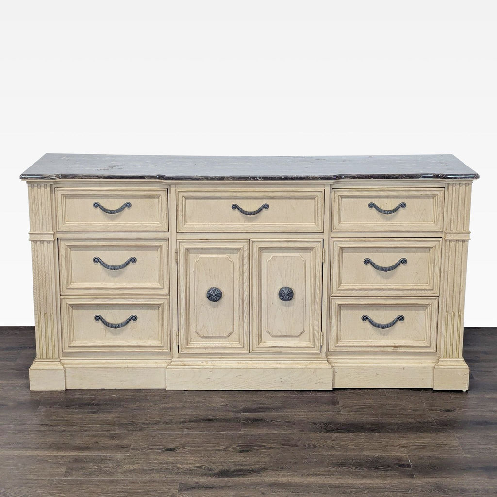 1. Stanley Furniture dresser with a marble top, light wood finish, and nine drawers for ample storage.  