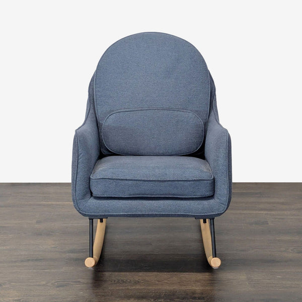 Delta Children blue rocking chair with cushioned seat and wooden rockers, perfect for relaxing in a nursery.