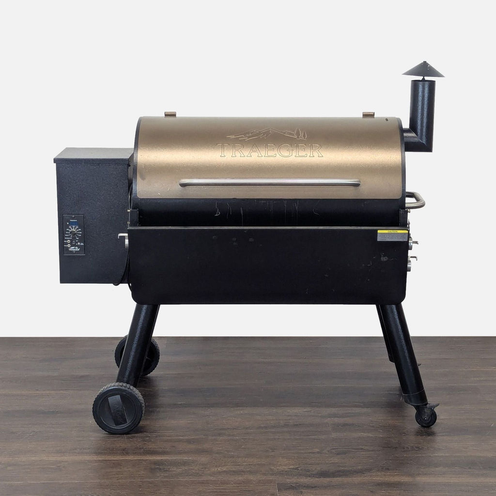 Traeger pellet grill with sturdy metal body, wheeled legs, and a secure handled lid, ideal for outdoor cooking.