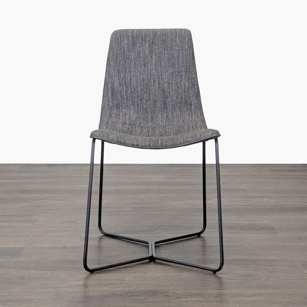 Bentwood dining chair with cushioned seat and iron legs by West Elm.  