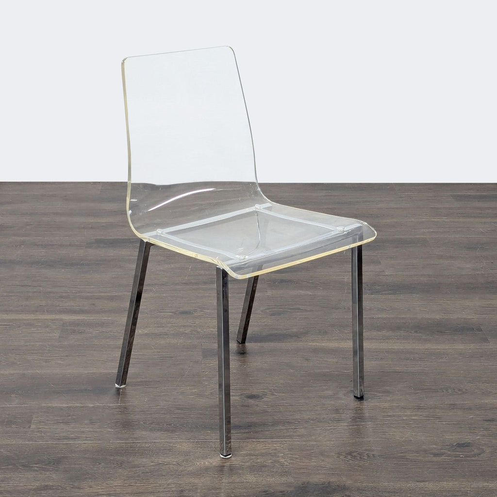 3. Angled view of a minimalist dining chair featuring a clear seat and back with metallic legs.