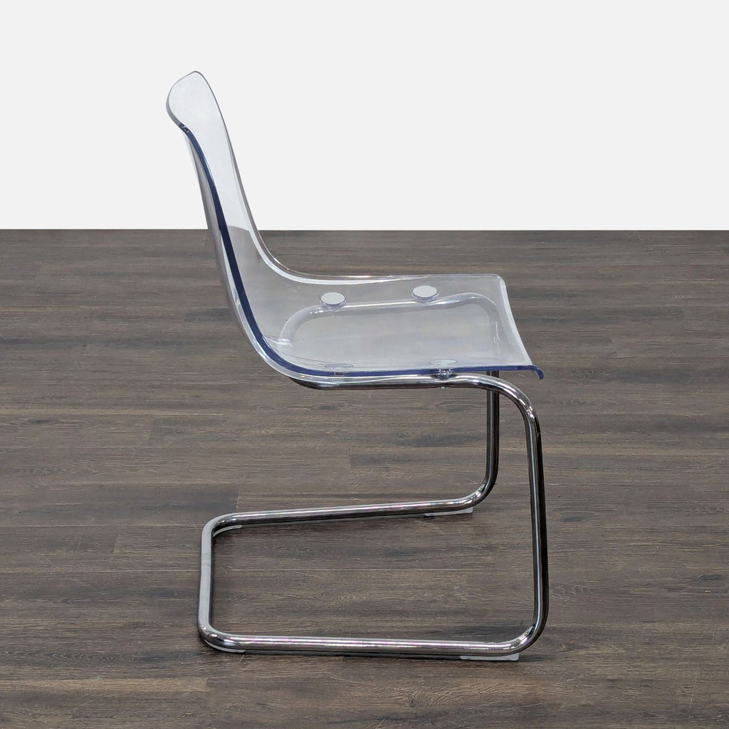 Ikea dining chair from the Dining Chairs category; plastic seat, chrome-plated metal frame.