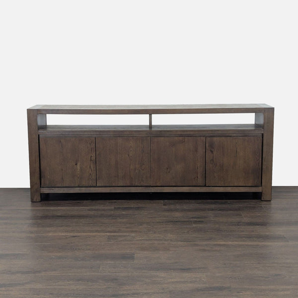 Entertainment center by Living Spaces featuring double doors, interior shelving, and open upper shelves.