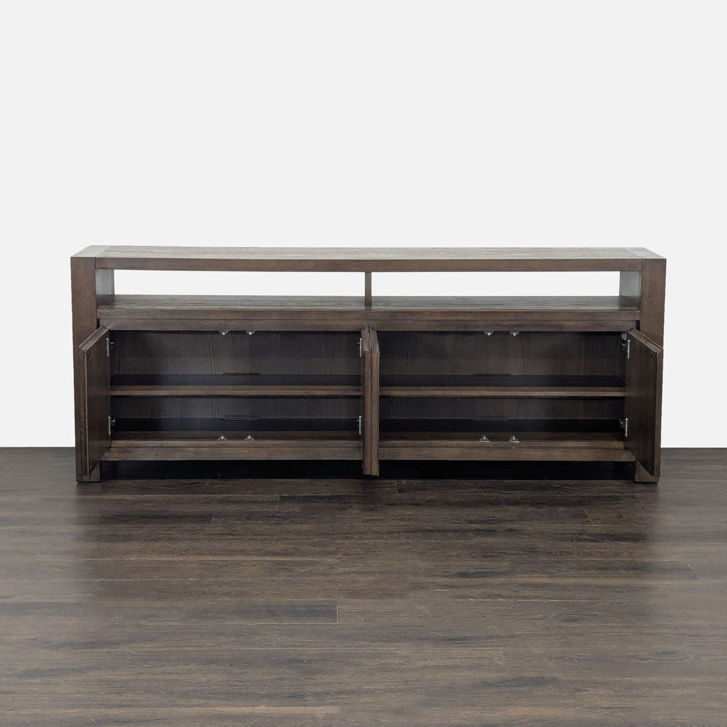 Modern Living Spaces entertainment center with double cabinet doors and open display shelving above.
