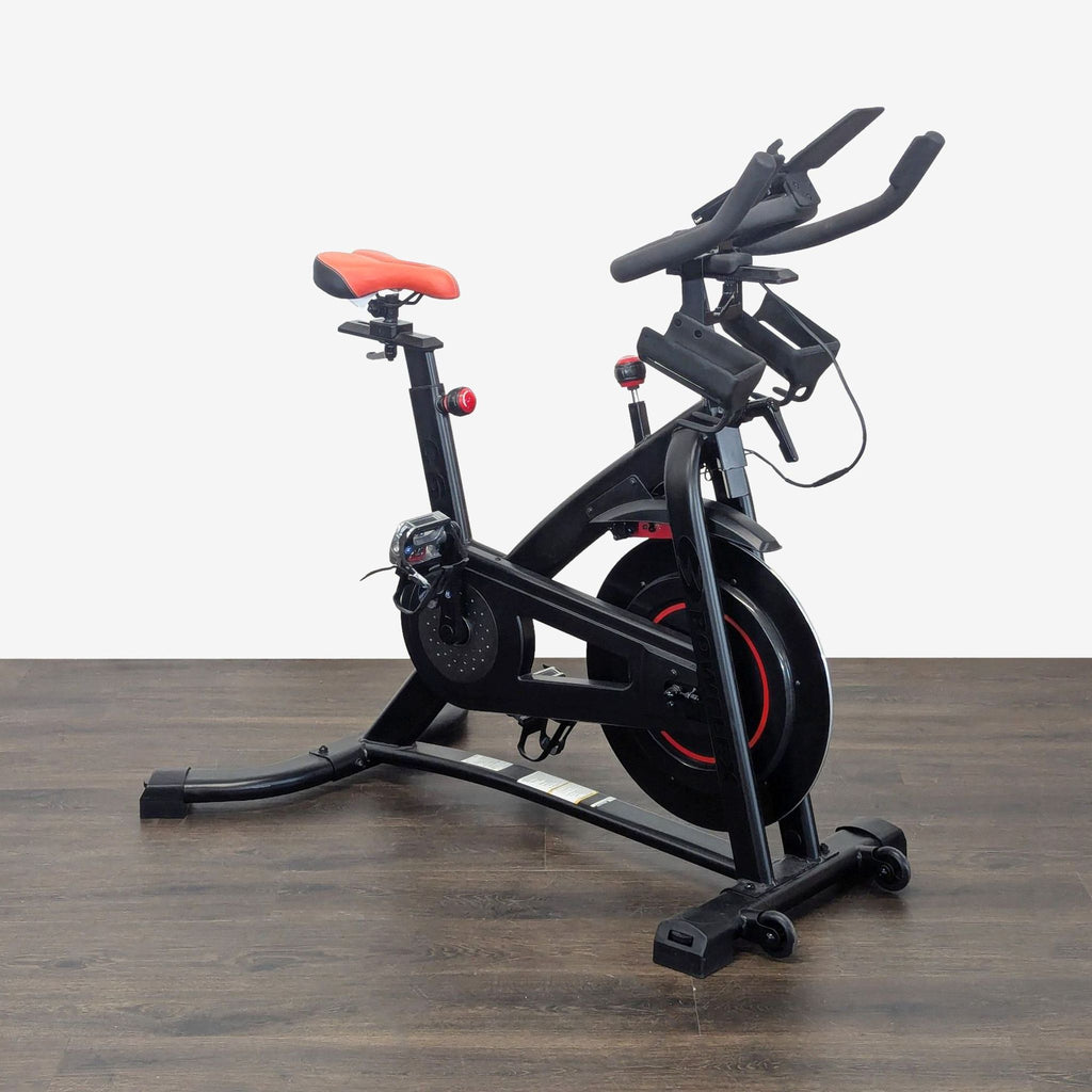 Sturdy Bowflex exercise bike featuring a comfortable seat, smooth rides, and integrated wheels for easy movement.