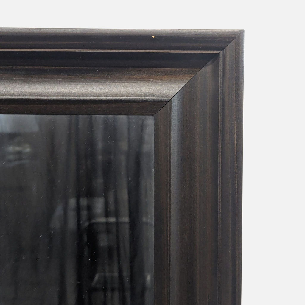 3. Close-up of the Ikea mirror’s dark wood frame, highlighting the corner joinery and textured finish.