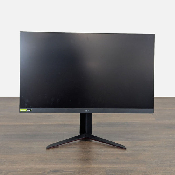 LG UltraGear 32-inch monitor with sleek design, sturdy base, and G-SYNC, perfect for gaming or work.