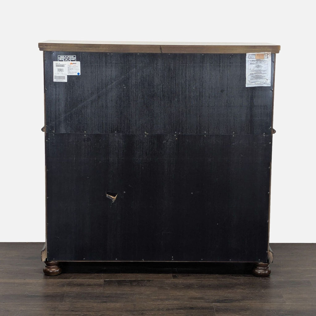 Cherry credenza with bun feet, glass cabinet doors, wine storage, and exterior shelving by Ashley Furniture.