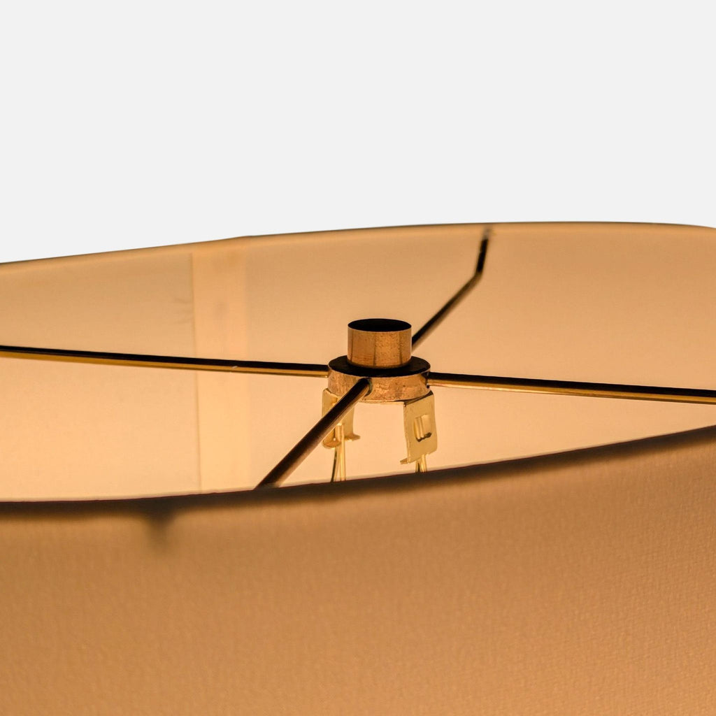 Stylish table lamp featuring a sturdy cross base, simple white shade, and versatile for many room styles.