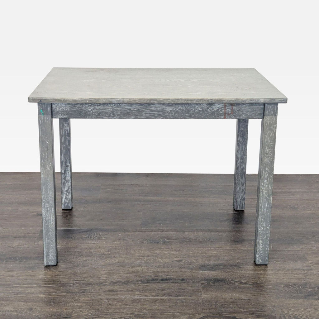 Children's table by Pottery Barn, Carolina model in sturdy gray wood, slatted sides, versatile for study or play.