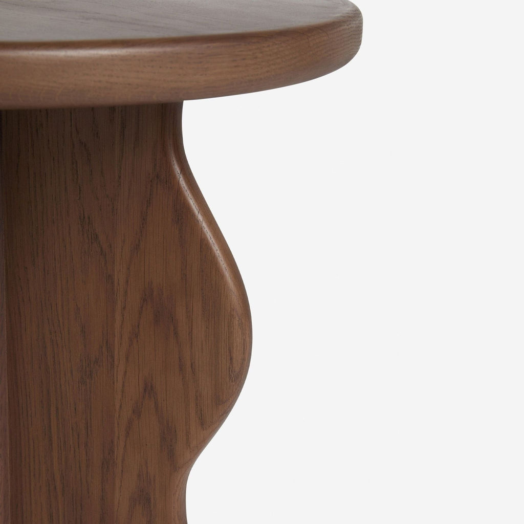 2. Close-up of curved oak veneer detailing on a modern side table from Lulu and Georgia.