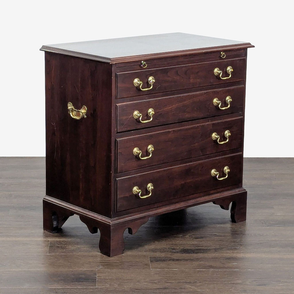 Stickley brand bachelor's chest end table, Chippendale design, adorned with brass details.