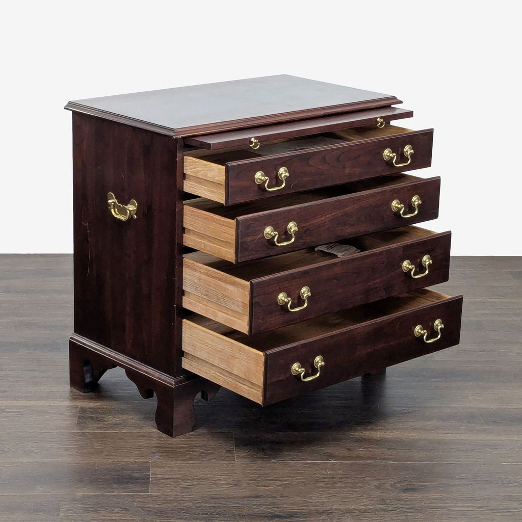 End table by Stickley in Chippendale style featuring brass embellishments and elegant woodwork.